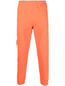 Heron Preston pantalon de jogging fuselé à imprimé HPNY - Orange