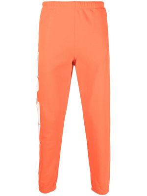 Heron Preston pantalon de jogging fuselé à imprimé HPNY - Orange