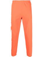 Heron Preston pantalon de jogging fuselé à imprimé HPNY - Orange