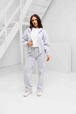 Guess Habi Trainingspak Dames Licht Blauw - Maat L - Kleur: Lichtblauw | Soccerfanshop