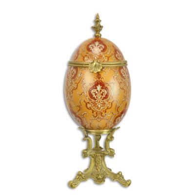 A BRONZE MOUNTED PORCELAIN EGG SHAPED BOX