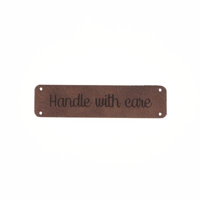 Leren label 'Handle with care' 15x60mm - 2 stuks Leren label 'Handle with care' 15x60mm - 2 stuks