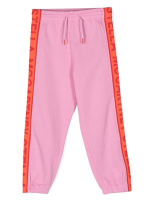 Stella McCartney Kids pantalon de jogging fuselé à logo imprimé - Rose