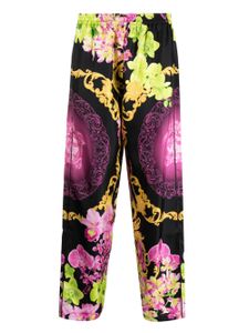 Versace pantalon en soie à fleurs - Noir