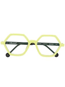 L.A. EYEWORKS lunettes de vue géométriques à design transparent - Jaune