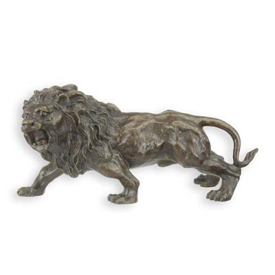 A BRONZE SCULPTURE OF A LION