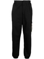 Moschino pantalon fuselé à design stretch - Noir