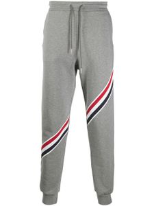 Thom Browne pantalon de jogging à bande tricolore - Gris