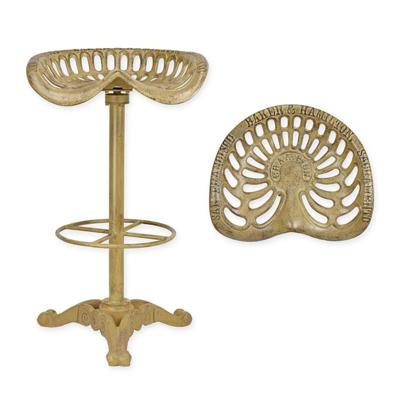 A CAST IRON BAR STOOL, BROWN