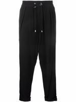 Balmain pantalon de jogging fuselé en crêpe - Noir