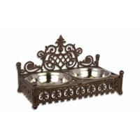 A CAST IRON DOG WATER AND FOOD BOWL