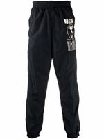 Moschino pantalon de jogging à logo imprimé - Noir