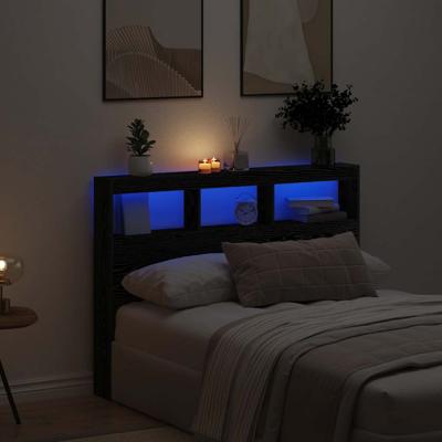 Hoofdbordkast met LED 140x17x102 cm zwart eikenkleurig