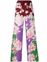 Valentino Garavani pantalon à fleurs - Rouge