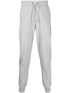 Tommy Hilfiger logo-print tapered track pants - Gris