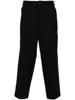 White Mountaineering pantalon fuselé à boutonnière - Noir