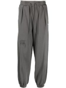 Musium Div. pantalon de jogging à effet usé - Gris