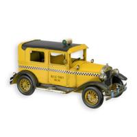 A TIN MODEL OF A YELLOW CAB