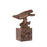 A BRONZE SCULPTURE OF AN EAGLE A BRONZE SCULPTURE OF AN EAGLE