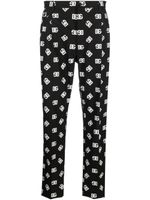 Dolce & Gabbana pantalon fuselé à motif monogrammé - Noir