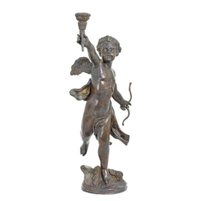 A BRONZE CUPID CANDLE HOLDER