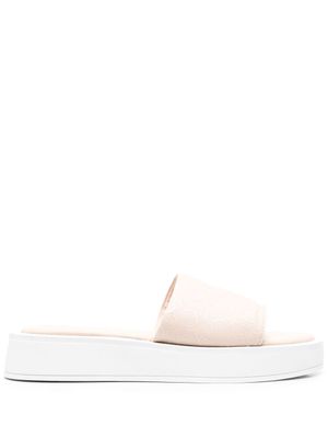 Calvin Klein claquettes oversize à motif monogrammé - Tons neutres