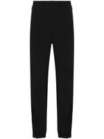 MSGM pantalon fuselé à logo brodé - Noir