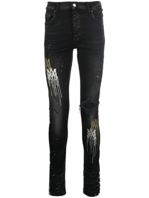 AMIRI jean skinny à effet taches de peinture - Noir