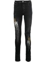 AMIRI jean skinny à effet taches de peinture - Noir