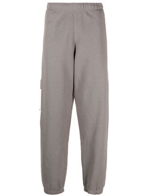Heron Preston pantalon de jogging en coton à logo imprimé - Gris