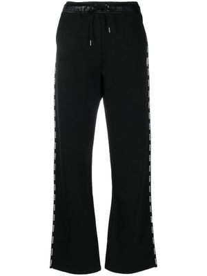 Moncler pantalon de jogging à bandes logo - Noir
