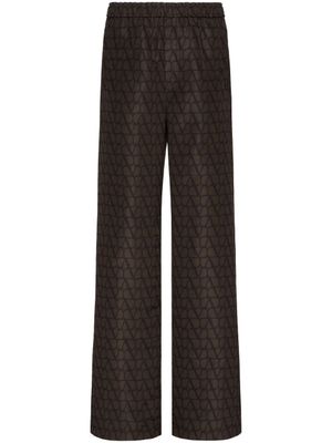 Valentino Garavani pantalon ample à logo imprimé - Marron