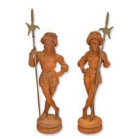 A PAIR OF RUSTY CAST IRON SWISS GUARD STATUES A PAIR OF RUSTY CAST IRON SWISS GUARD STATUES