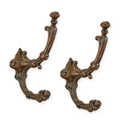 A PAIR OF CAST IRON BROWN COAT HOOKS