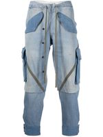 Greg Lauren jean fuselé à design à empiècements - Bleu