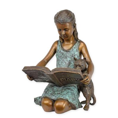 A BRONZE SCULPTURE OF A GIRL READING IN HER DIARY