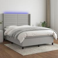 Boxspring met matras en LED stof lichtgrijs 140x190 cm