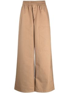 Off-White pantalon ample à logo embossé - Marron