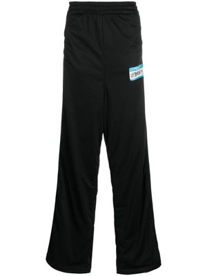 VETEMENTS pantalon ample à logo imprimé - Noir
