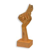 A RUSTY CAST IRON FIGURINE OF A FACE RESTING ON HAND A RUSTY CAST IRON FIGURINE OF A FACE RESTING ON HAND
