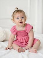 Babyjurk met smok van katoenen gaas snoepjesroze