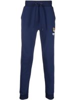 Moschino pantalon de jogging à patch logo - Bleu