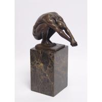 A BRONZE SCULPTURE CALLED THE DIVE