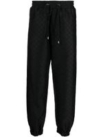 Balmain pantalon de jogging à imprimé monogrammé - Noir - thumbnail