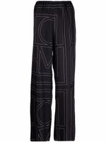 TOTEME pantalon en soie à motif monogrammé - Noir