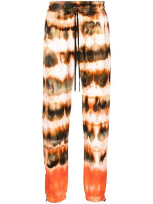 AMIRI pantalon de jogging à imprimé tie-dye - Marron