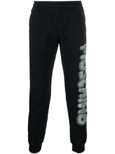 Moschino pantalon de jogging à logo imprimé - Noir