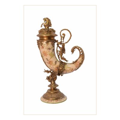 A BRONZE MOUNTED PORCELAIN CORNUCOPIA HORN