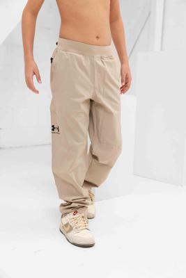 Under Armour Unstoppable Tapered Trainingsbroek Kids Beige - Maat 140 - Kleur: Beige | Soccerfanshop