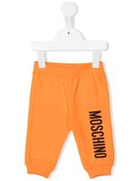 Moschino Kids pantalon de jogging à logo imprimé - Orange